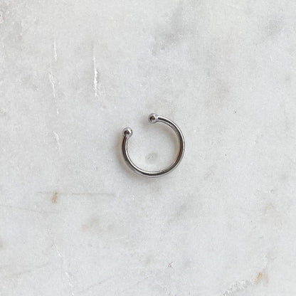 Silver ear cuff by HoraceJewelry, showcasing a sleek, minimalist design for effortless style and chic elegance.