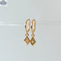 HoraceJewelry Lozo Boucles d'oreilles with elegant hoop design showcasing shiny gold finish and intricate detailing.