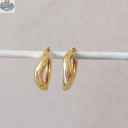 Gold hoop earrings by HoraceJewelry featuring sleek, modern design, perfect for everyday wear and stylish accessorizing.