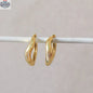 Gold hoop earrings by HoraceJewelry featuring sleek, modern design, perfect for everyday wear and stylish accessorizing.