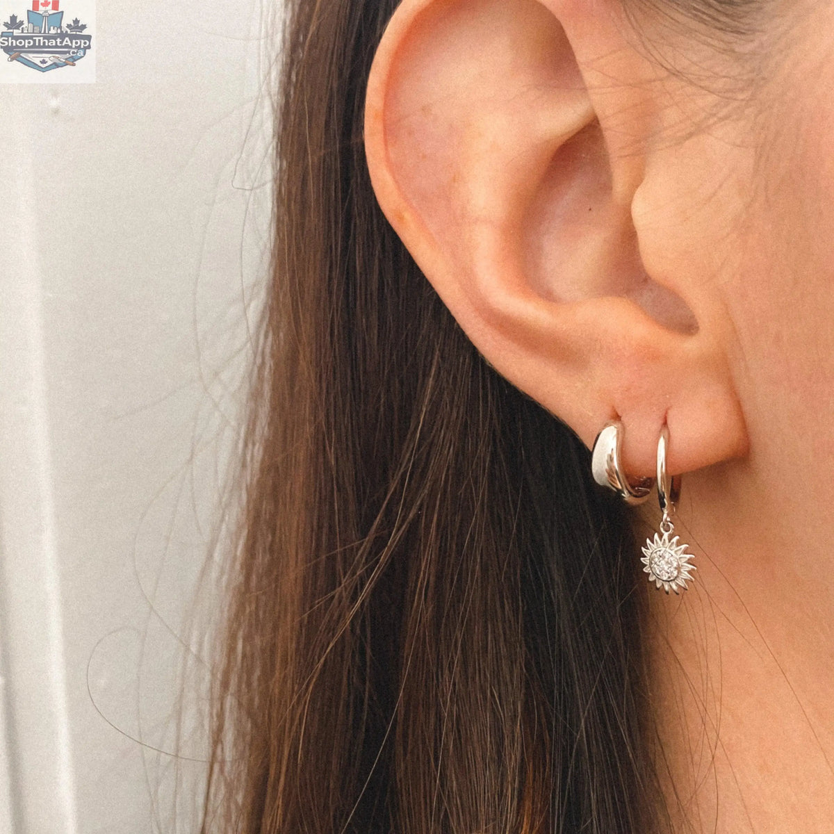 HoraceJewelry Toura travel gear-inspired earrings featuring elegant hoop design with adventure-themed details.