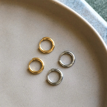 Gold mini hoop earrings from HoraceJewelry, stylish Les Minis Hoops perfect for everyday wear and special occasions.
