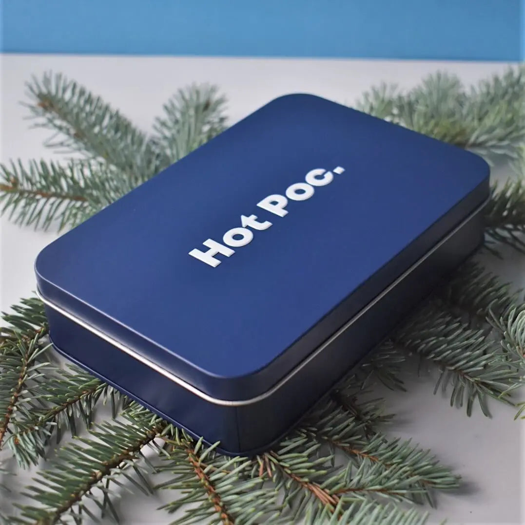 HotPoc eco-friendly reusable body warmers 2-pack in compact white plastic cases, designed for chemical heat therapy.