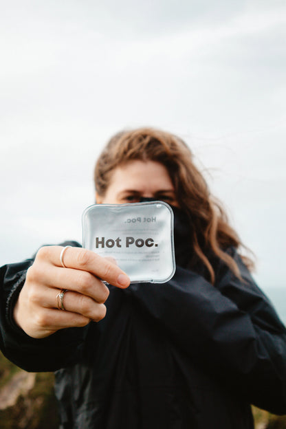Hot Poc eco-friendly reusable hand warmers in a 4-pack, shown in an open and closed position on a neutral background.