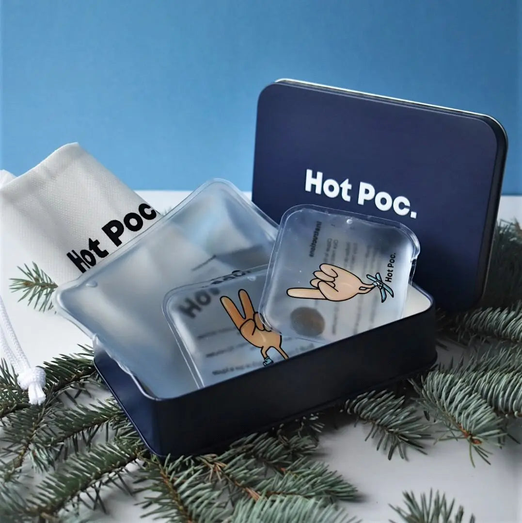 Hot Poc Eco-Friendly hand warmer set in a reusable, sustainable heat container, ideal for skiing and hiking in cold weather.