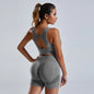 Women's yoga set with stylish vest and shorts, featuring a comfortable fit and breathable fabric for active workouts.