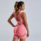 Women's yoga set with stylish vest and shorts, featuring a sleek design ideal for active workouts and comfortable movement.