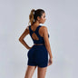 Women's yoga set with stylish vest and shorts, featuring comfortable fabric and modern design for active workouts.