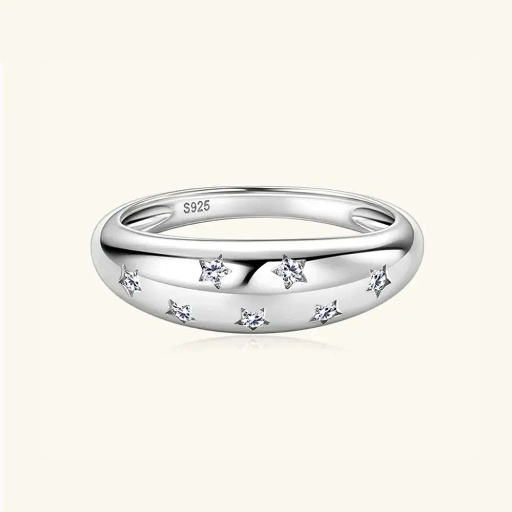 Sterling silver moissanite star ring with celestial design, showcasing sparkling gemstone and delicate band, elegant jewelry piece.