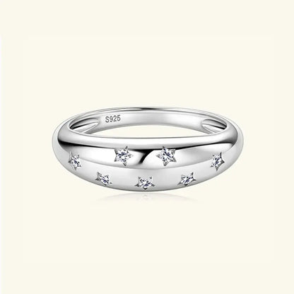 Sterling silver moissanite star ring with celestial design, showcasing sparkling gemstone and delicate band, elegant jewelry piece.