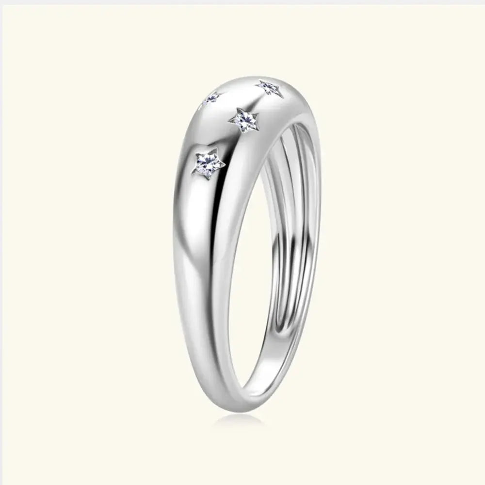 Sterling silver moissanite star ring featuring a celestial star design, elegant jewelry piece with sparkling gemstone accents.