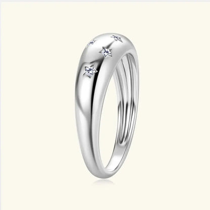 Sterling silver moissanite star ring featuring a celestial star design, elegant jewelry piece with sparkling gemstone accents.