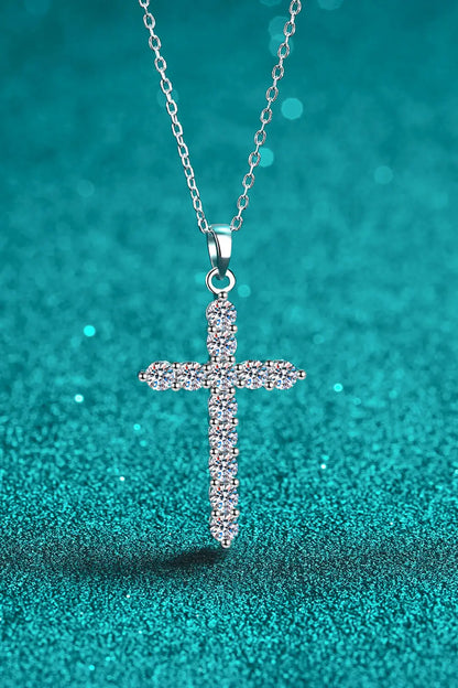 Sterling silver cross necklace with sparkling moissanite gemstones, elegant jewelry piece featuring intricate design and radiant shine.