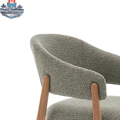 Mint green Hygge Design House Fiol dining chair with natural wood frame and upholstery, showcasing modern and stylish seating.