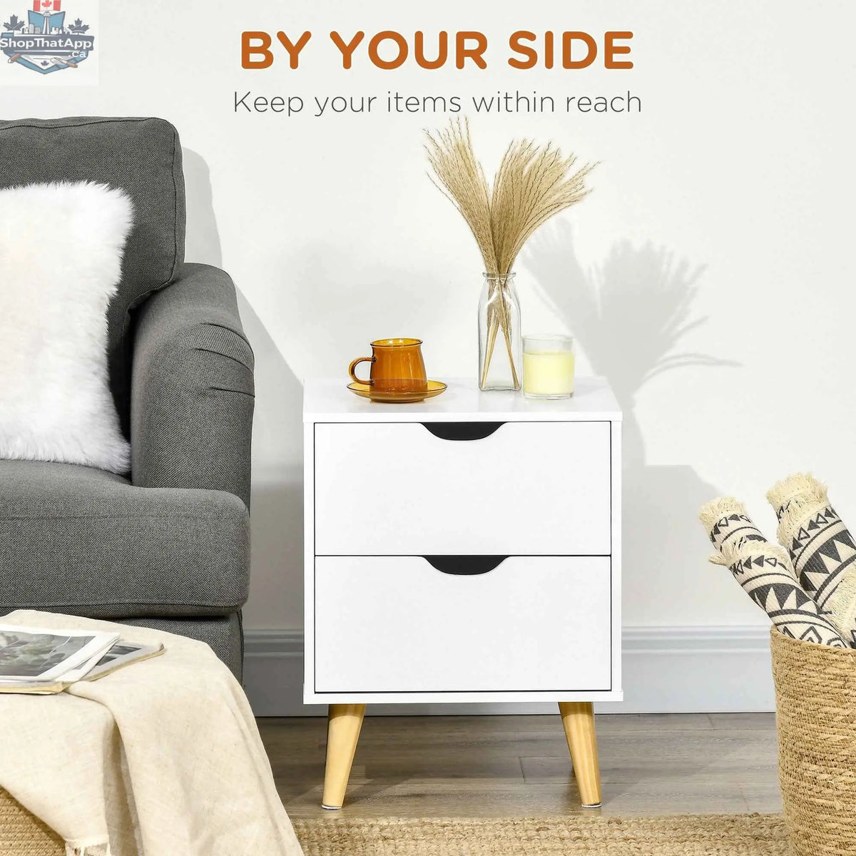 White Jesse nightstand with two drawers and pine wood legs, bedroom furniture by SLOTH Nation, shown with a modern bedroom setting.