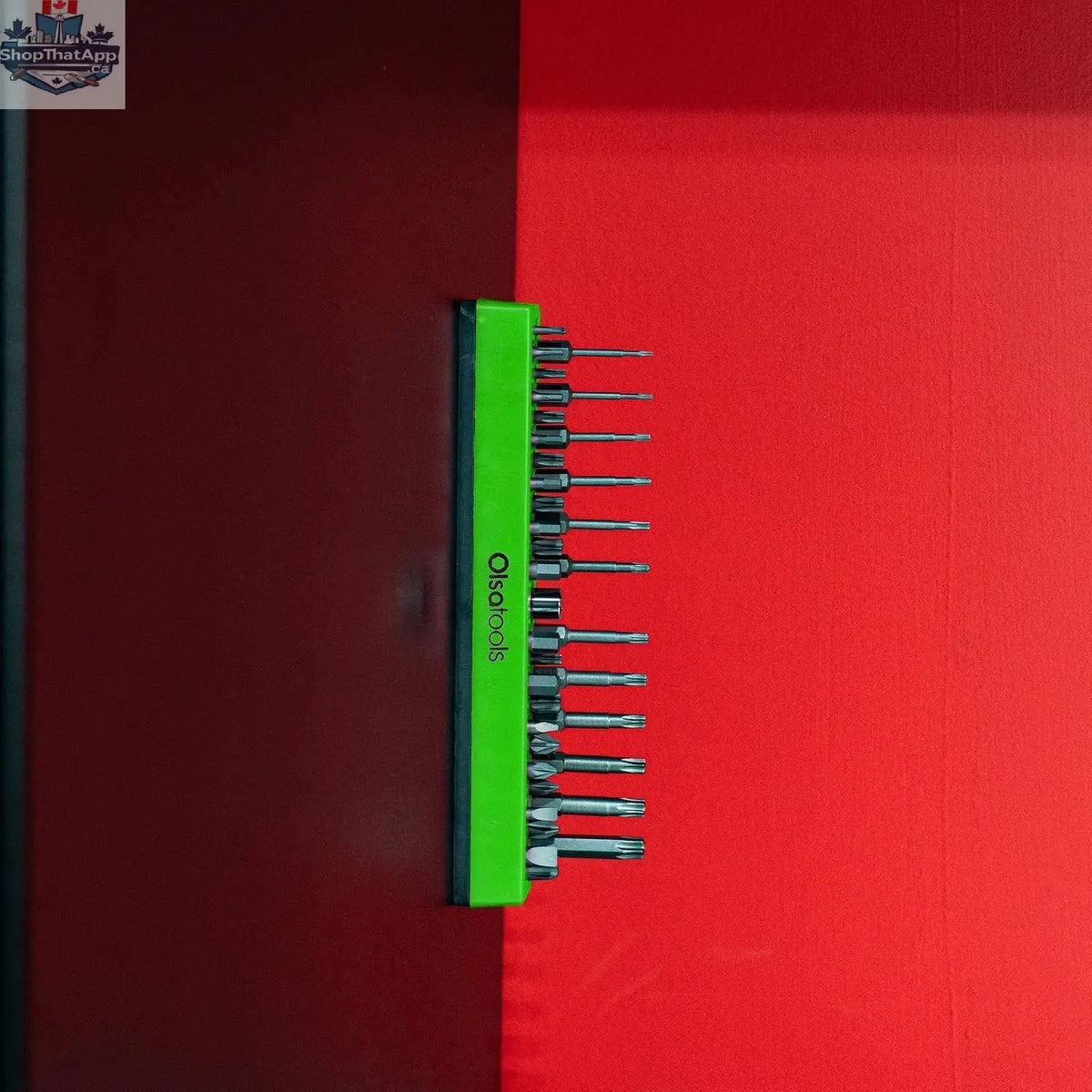 Olsa Tools Canada magnetic hex bit organizer holding various hex bits on a workbench, demonstrating easy tool access and management.