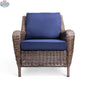 Krikacy Cambridge brown wicker outdoor club chair with indigo cushions, stylish patio furniture for outdoor relaxation.