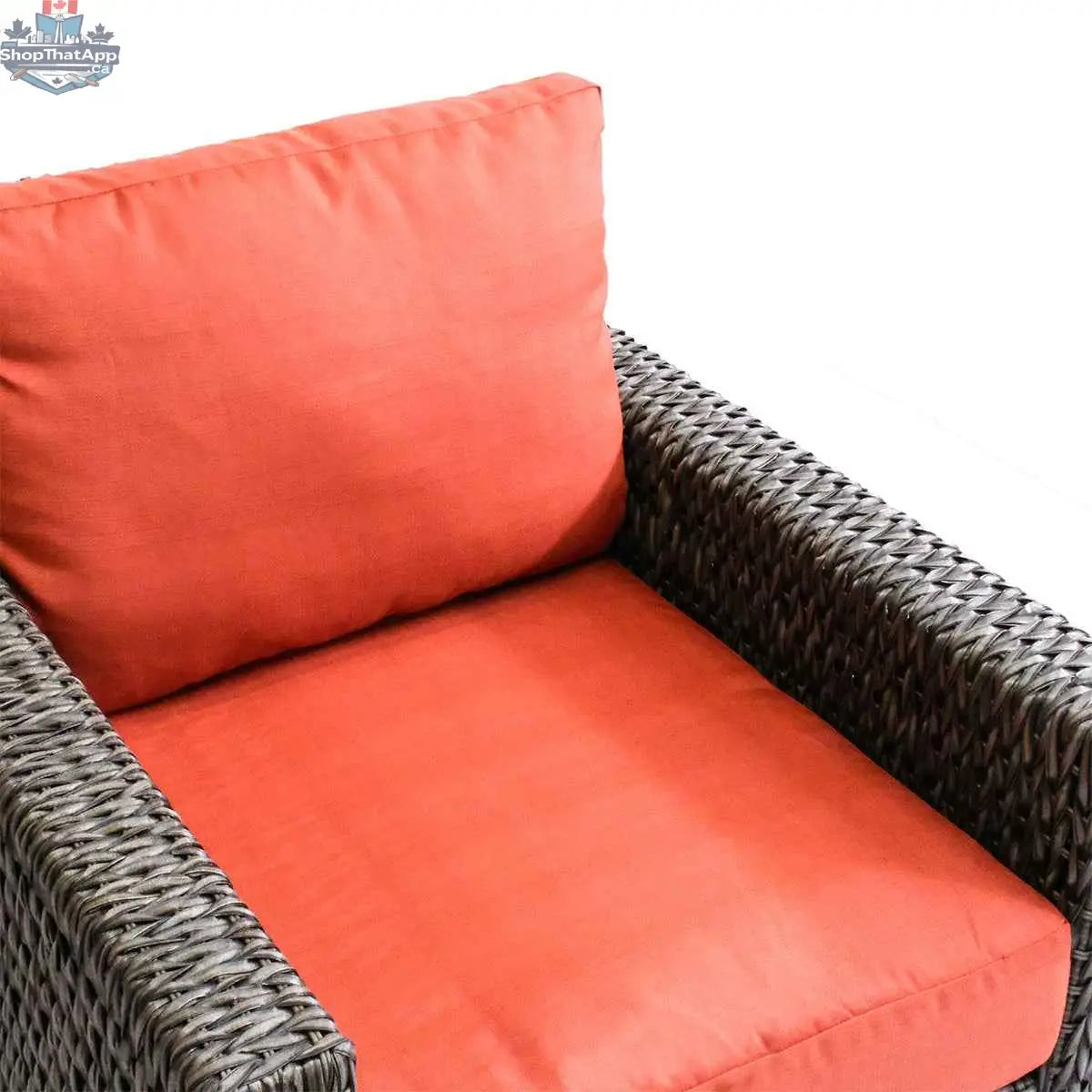 Krikacy Laguna Point outdoor wicker club chair with brown finish and orange cushions, perfect for stylish patio relaxation.