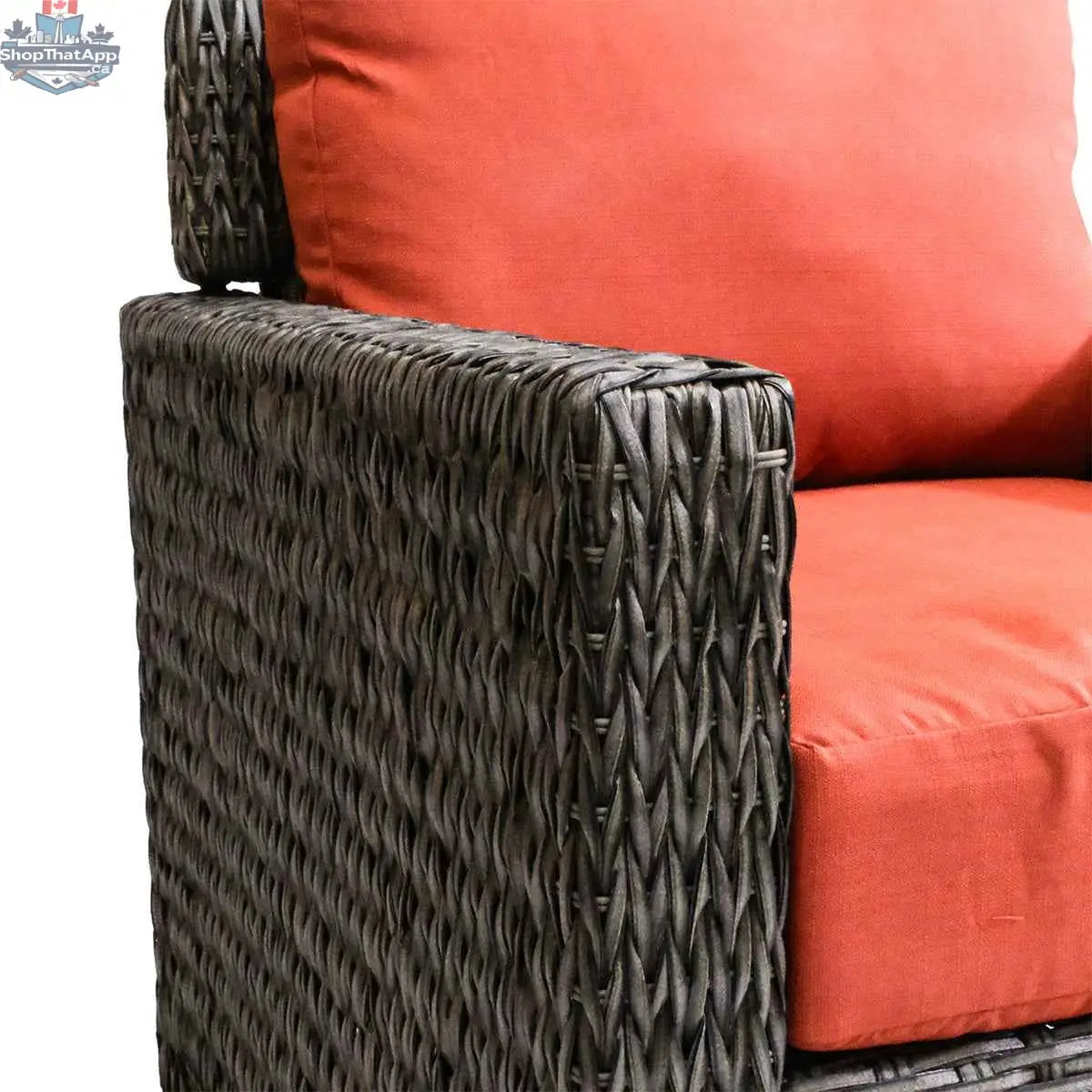 Brown Laguna Point wicker club chair by Krikacy with orange cushions, perfect for stylish outdoor patio relaxation.