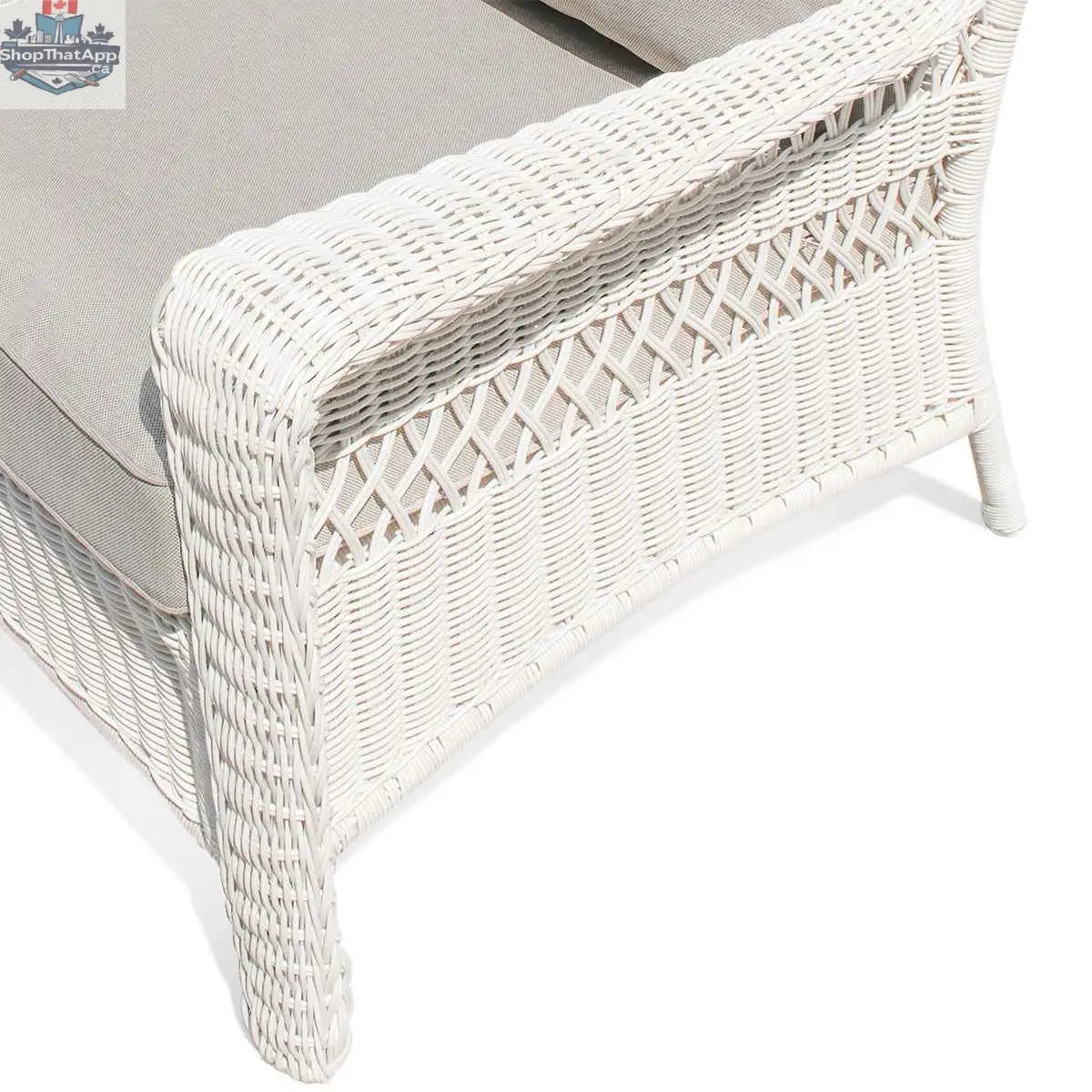 Krikacy Park Meadows white wicker outdoor club chair with plush cushion, stylish and durable patio seating for outdoor lounging.
