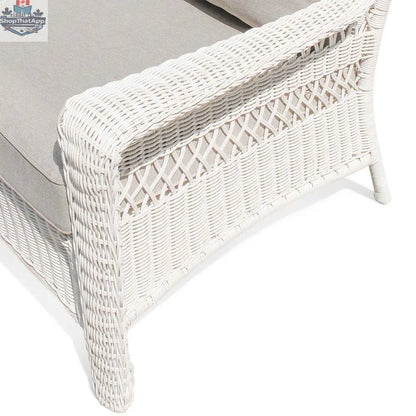 Krikacy Park Meadows white wicker outdoor club chair with plush cushion, stylish and durable patio seating for outdoor lounging.