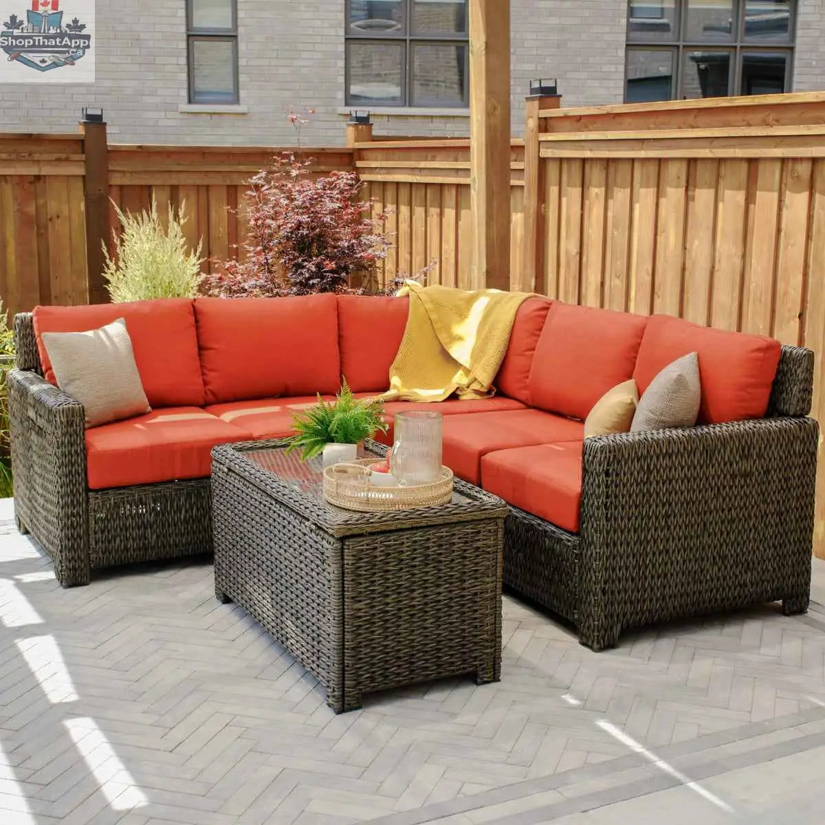Krkacy Laguna Point wicker outdoor storage chest coffee table with Park Meadows wicker chair in a stylish patio setting