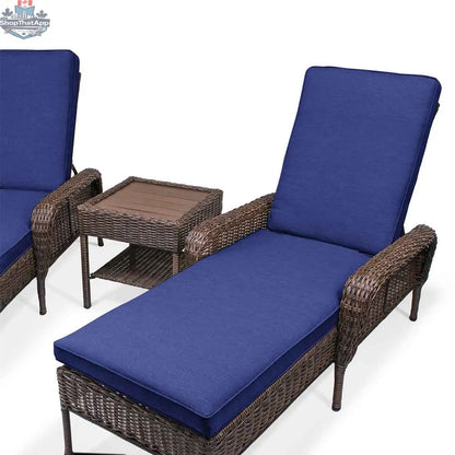 Krikacy Cambridge brown wicker outdoor chaise lounge set with indigo cushions, end table, perfect for outdoor relaxation.