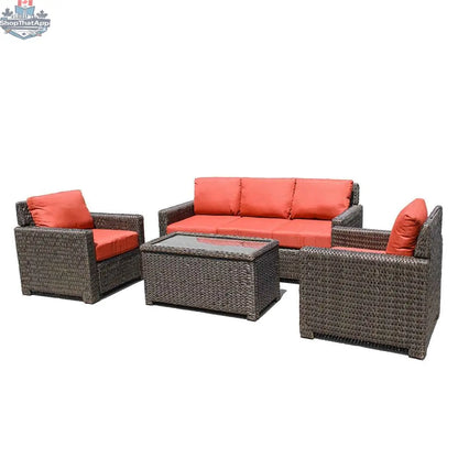 Krkacy Laguna Point outdoor wicker conversational set with four pieces, brown wicker frame, orange cushions, and outdoor patio furniture.