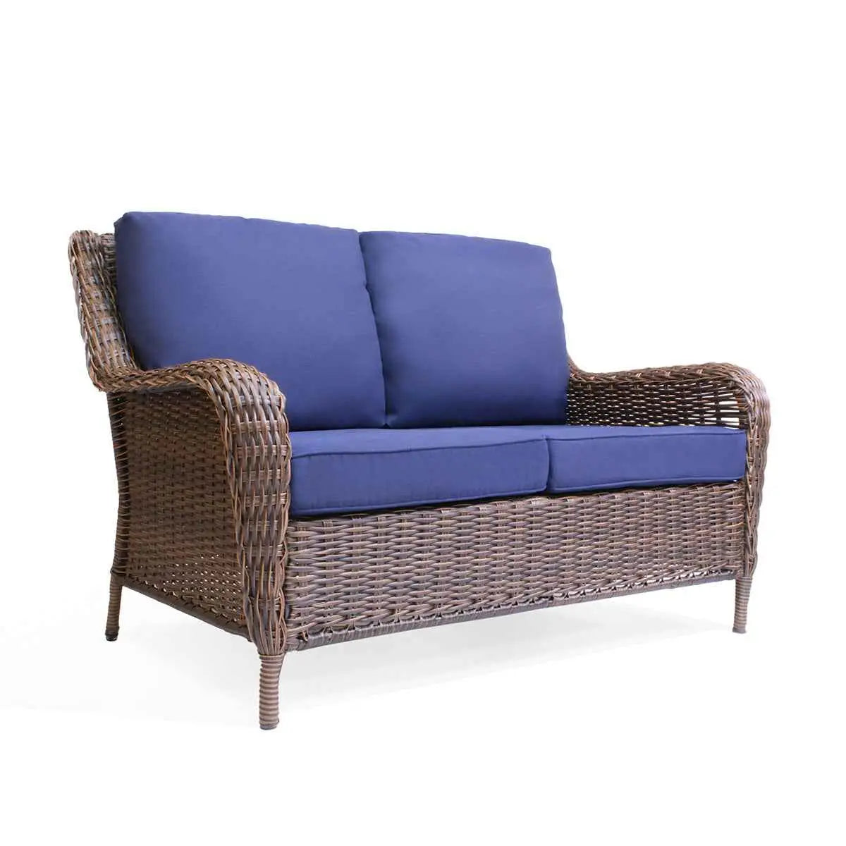 Krikacy Cambridge brown wicker outdoor loveseat with indigo cushions, showcasing a cozy seating area in a garden setting.