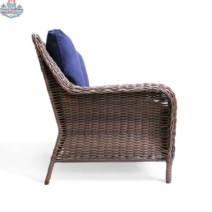 Krikacy Cambridge brown wicker outdoor loveseat with indigo cushions, showing a cozy seating area for outdoor relaxation.