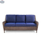 Krikacy Cambridge wicker outdoor loveseat sofa with brown wicker frame and indigo cushions, front view.
