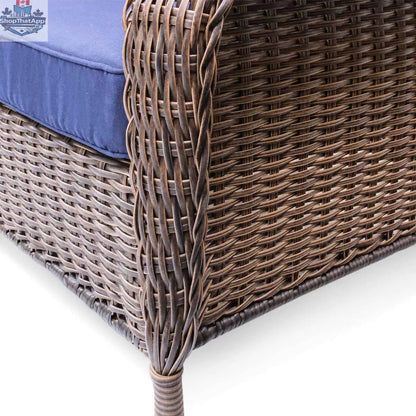 Krikacy Cambridge wicker outdoor loveseat with indigo cushions, brown woven wicker frame, and comfortable seating for outdoor patio.