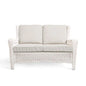 Krikacy Park Meadows white wicker loveseat for outdoor seating, featuring plush cushions and a stylish, durable design for outdoor comfort.