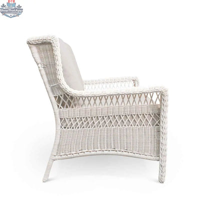 White wicker loveseat by Krikacy from Park Meadows, designed for stylish outdoor comfort, shown from the side view.