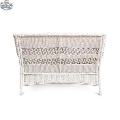 White wicker outdoor loveseat by Krikacy, with plush cushions and a stylish design for comfortable outdoor seating.