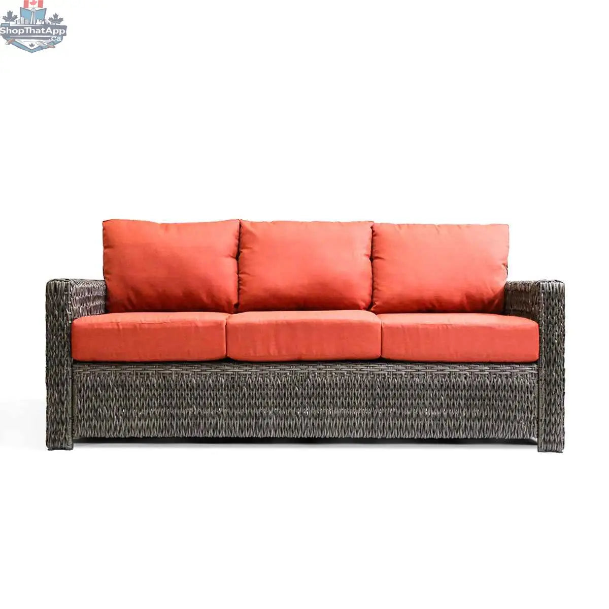 Krikacy Laguna Point outdoor wicker sofa with brown frame and orange cushions, stylish patio seating for relaxing outdoors.