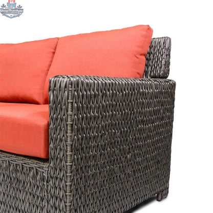 Krikacy Laguna Point outdoor wicker sofa with brown cushions, stylish sectional seating for patio relaxation.