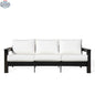 Krikacy Hickory outdoor sofa with black marine-grade polymer frame and white Sunbrella canvas cushions, ideal for outdoor comfort.