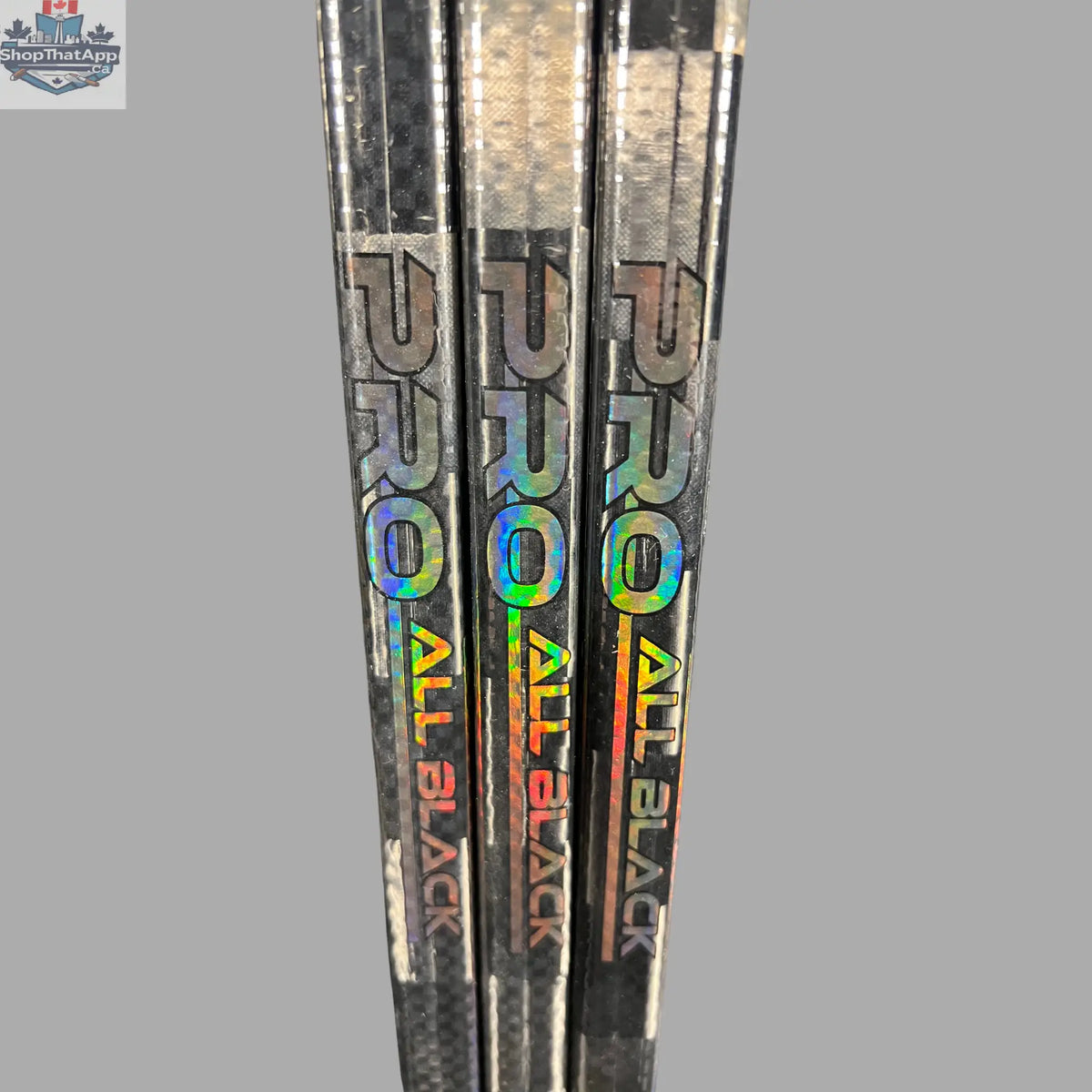 Black LabSports Pro All Black V2 hockey stick, intermediate performance gear with sleek design and durable construction.