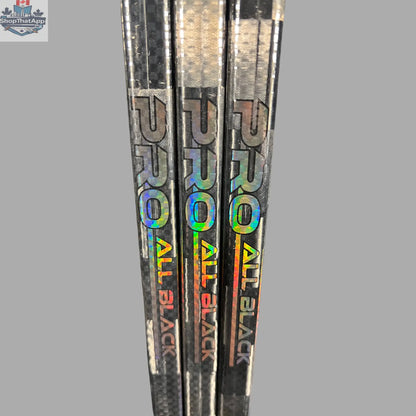 Black LabSports Pro All Black V2 hockey stick, intermediate performance gear with sleek design and durable construction.