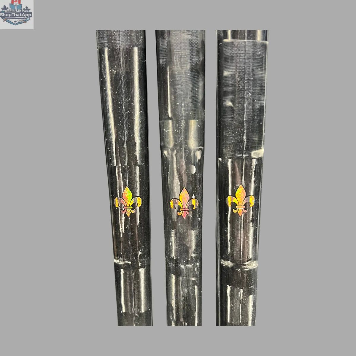 Close-up of LabSports Pro All Black V2 hockey stick shaft with detailed logo, highlighting its sleek black design and intermediate performance gear.