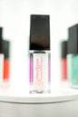 FencyGrace vegan fruit lip oil in a clear bottle with a natural flavor, designed for nourishing and hydrating lips.