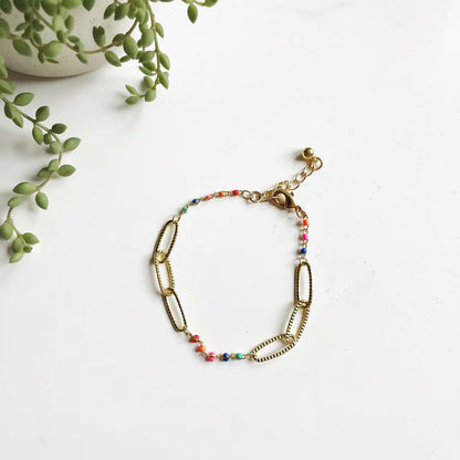 Gold plated chainlink bracelet with colorful enamel accents, stylish jewelry piece by Suzie Blue Canada.