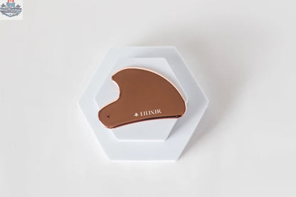 LILIXIR gift set with golden stainless steel gua sha tool for morning skincare routine, displayed on a white background.