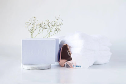 LILIXIR gift set with golden and white gua sha tools for morning skincare routine, featuring sleek, polished stone massage tools.