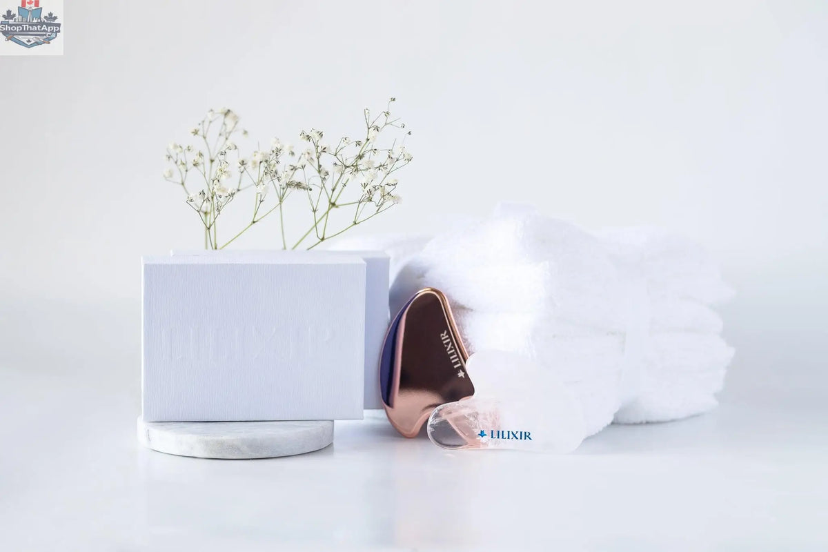 Golden and white LILIXIR acupressure facial lift massage stones for skin toning and facial rejuvenation.