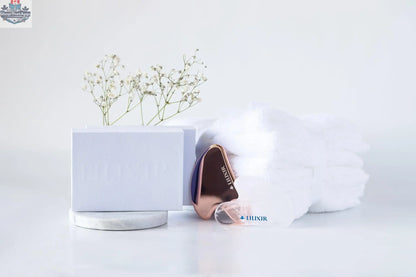 Golden and white LILIXIR acupressure facial lift massage stones for skin toning and facial rejuvenation.