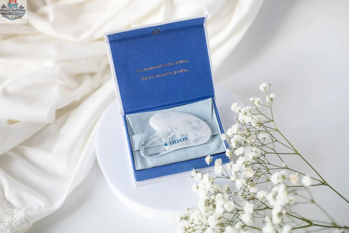 White crystal Gua Sha tool for acupressure and skincare, handcrafted massage stone from LILIXIR for facial and body massage.