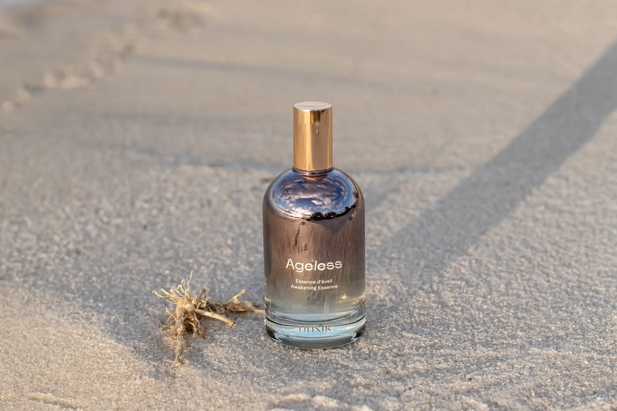 LILIXIR Ageless Awakening Essence mist bottle with a sleek design, ready to hydrate and rejuvenate skin.