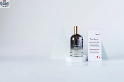 LILIXIR Ageless Awakening Essence mist bottle with clear spray nozzle, showcasing elegant packaging and product label.